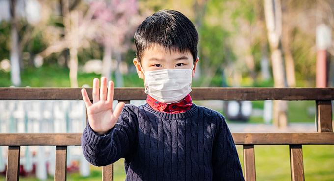 Little boy wearing surgical mask