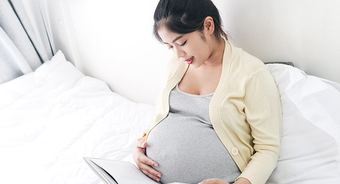 Pregnant woman read a book