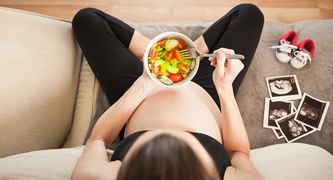 Pregnant woman eating healthy foods