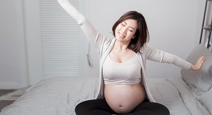 Pregnant woman waking up