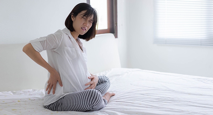 Pregnant woman having stomach ache