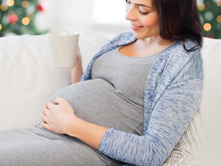 pregnant woman drinking hot tea